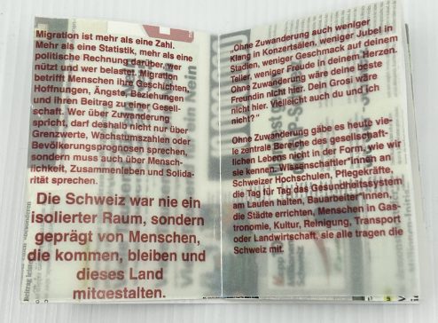 open spread: red text on tracing paper over newspaper fragments