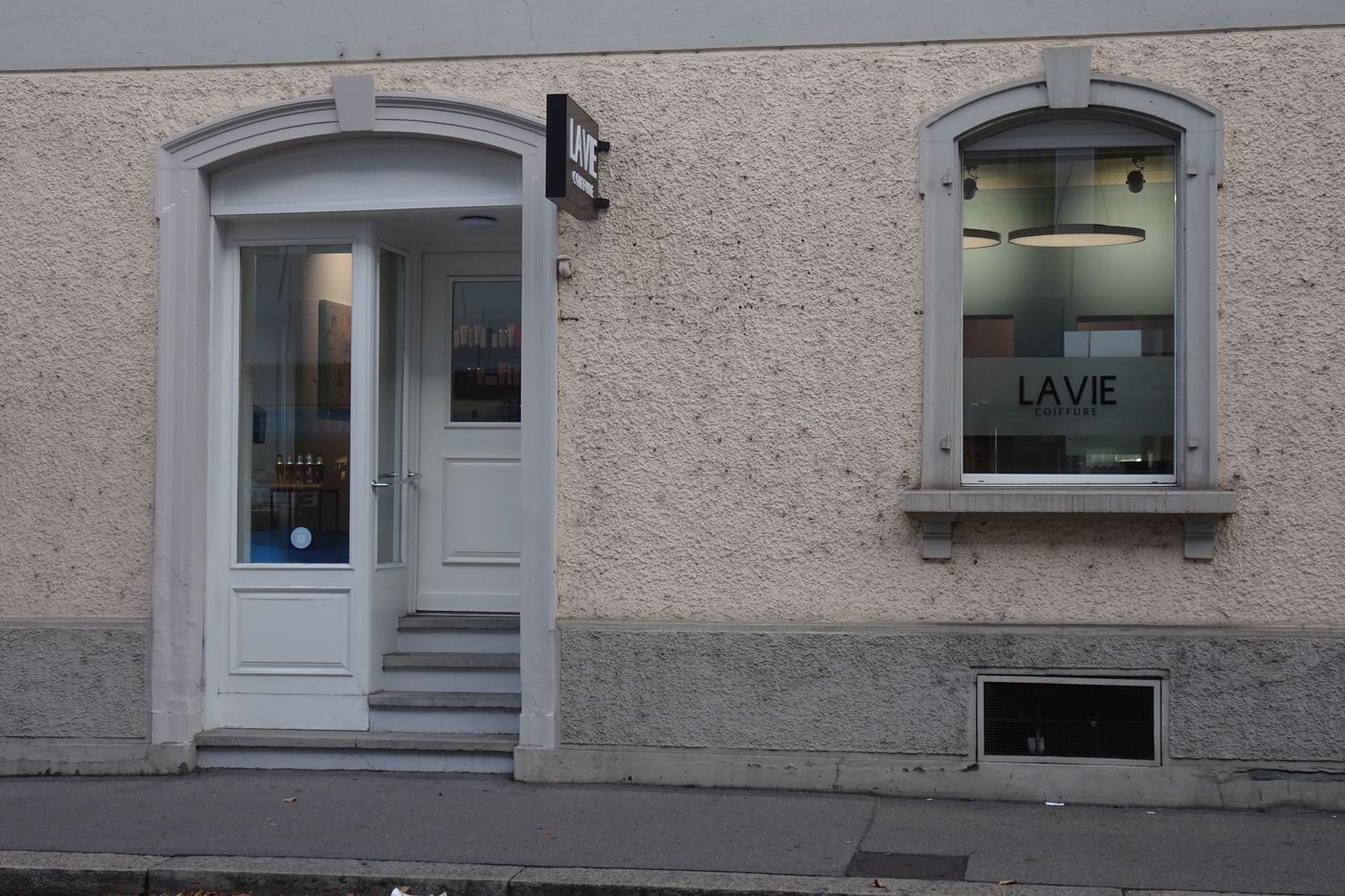 La Vie Coiffure, frosted window lettering on a pink facade