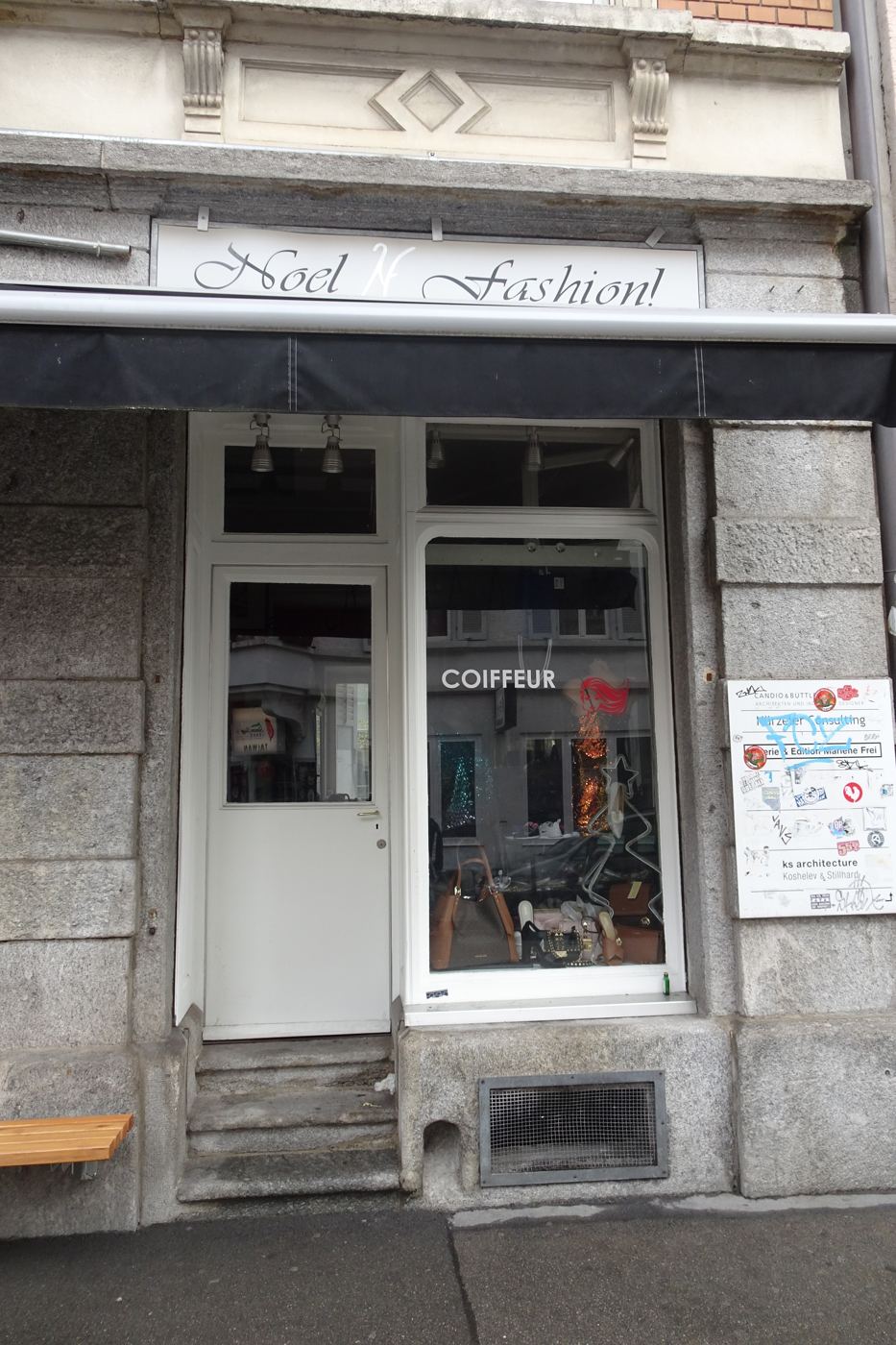 Noel Fashion, script sign and the word coiffeur in the window