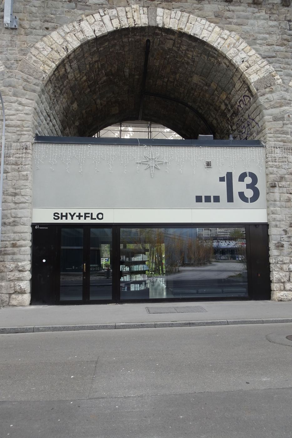 Shy+Flo in a viaduct arch, large stencil number 13